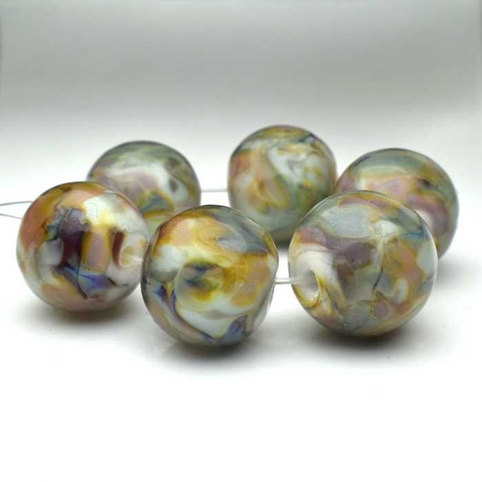 Whispering Orbs: Handmade Lampwork Glass Beads